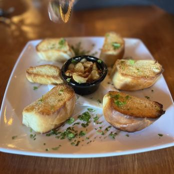 The Purple Garlic Italian Cafe signature dishes Garlic KnotsThe Purple Garlic PizzaChicken Parmesan Sub
